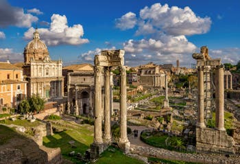 The Roman Forum, on the right, the Saturn Temple Columns, in Rome in Italy